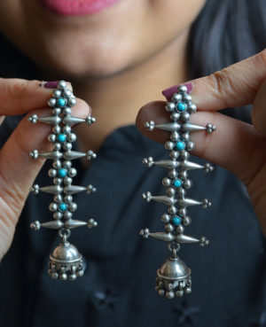 Fish bone shaped danglers | Six petal flower with green pearl silver earring