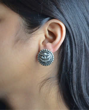 Silver stud earring with lotus and shell design