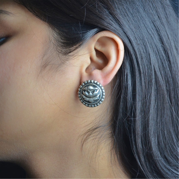 Silver stud earring with lotus and shell design